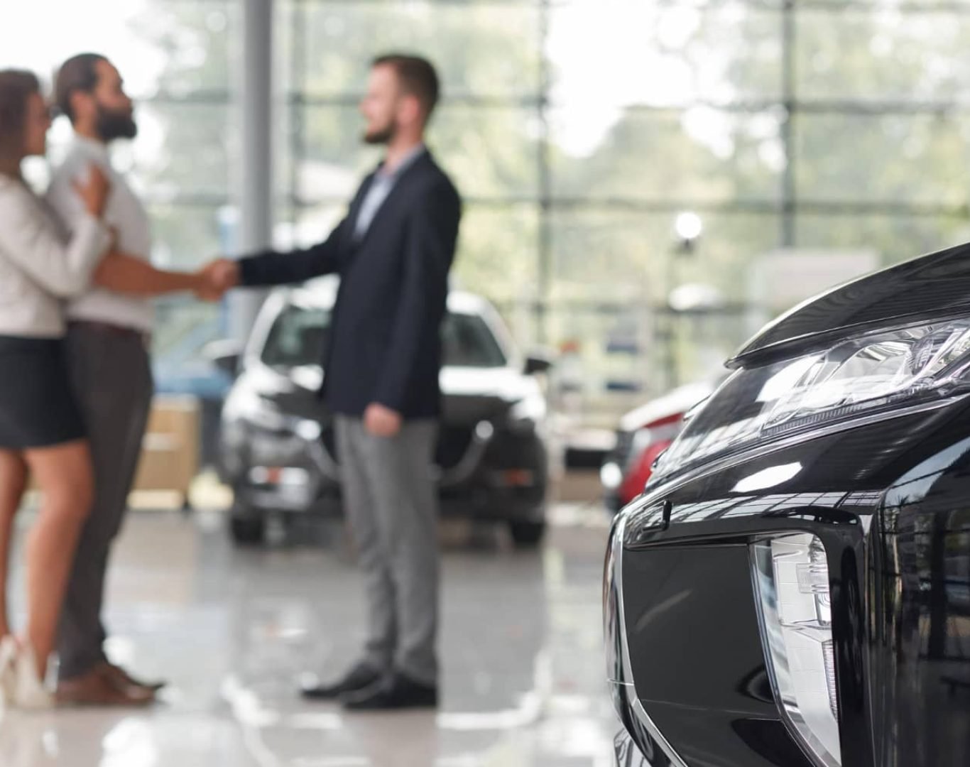 Commercial cleaner wiping down showroom floors at a South Florida car dealership