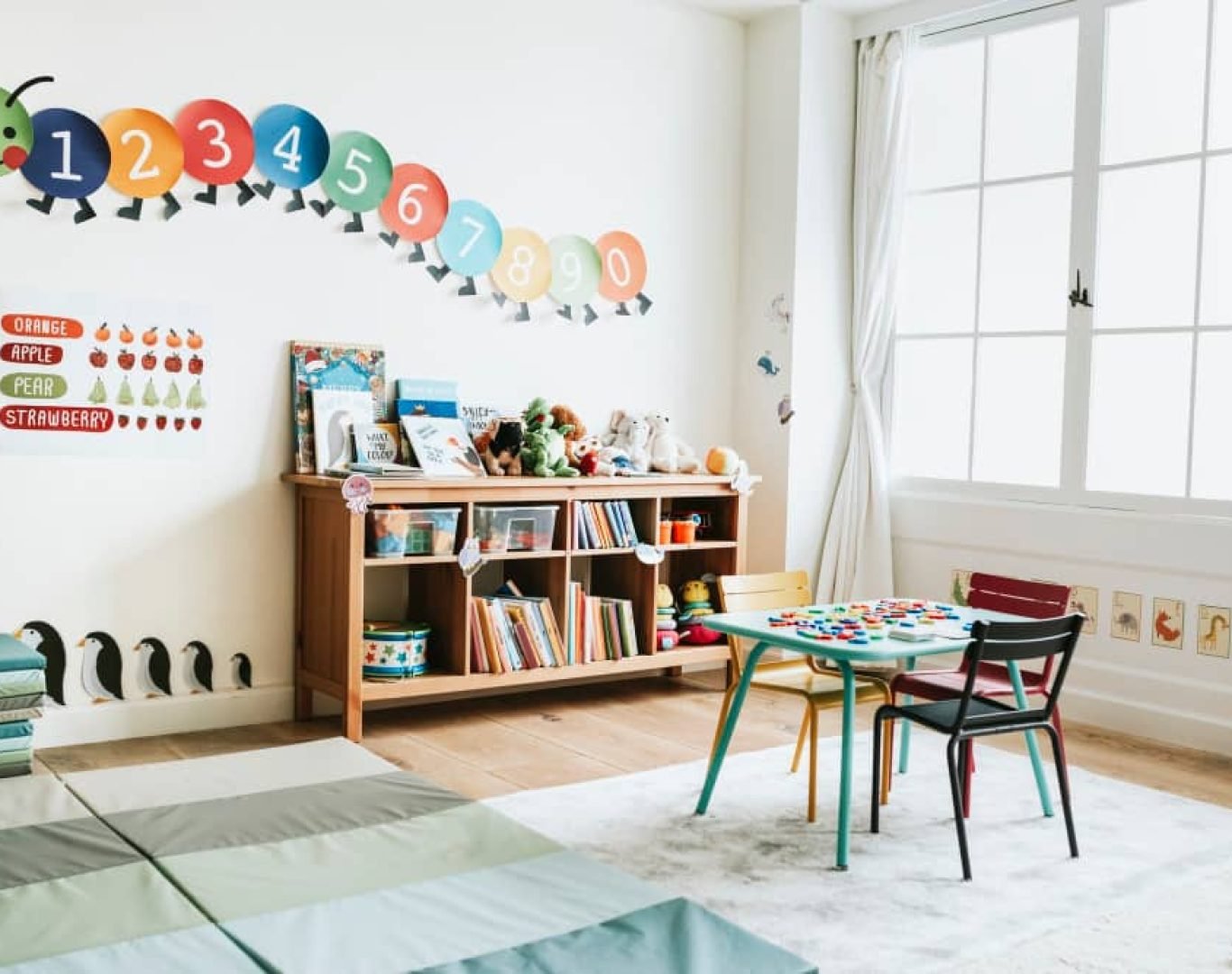Cleaner disinfecting classroom desks in a South Florida daycare